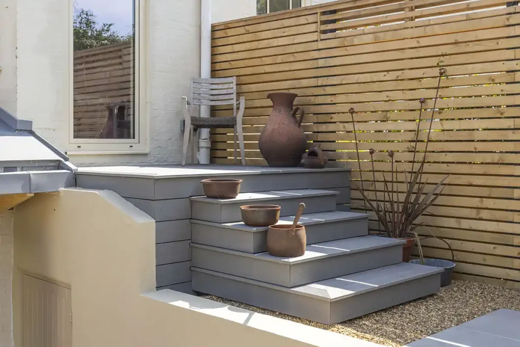 Composite decking steps in a garden in Norwich, Norfolk.