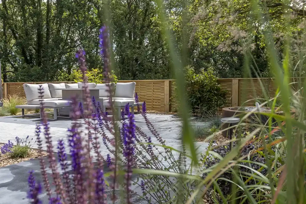 Patio and seating area at North Norfolk landscaped garden.