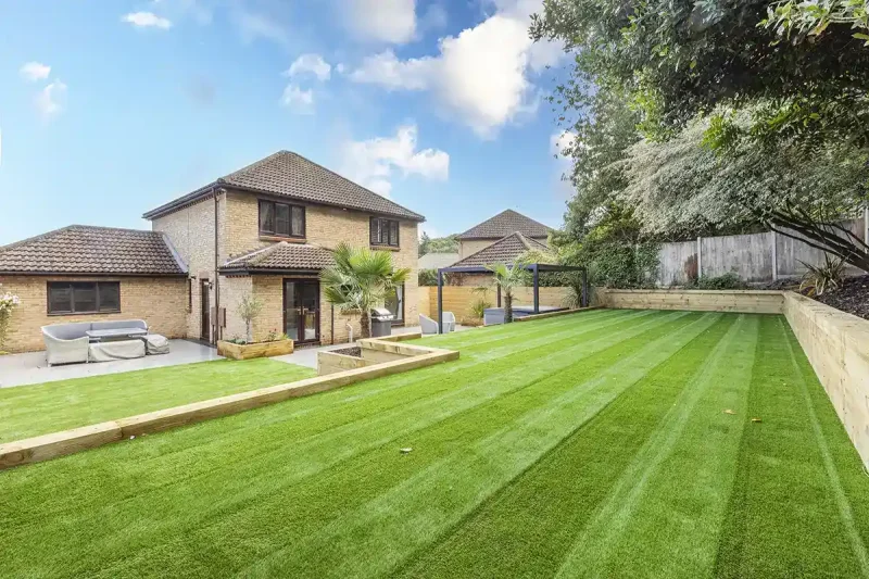 A Norfolk garden with artificial grass layed in the back garden.